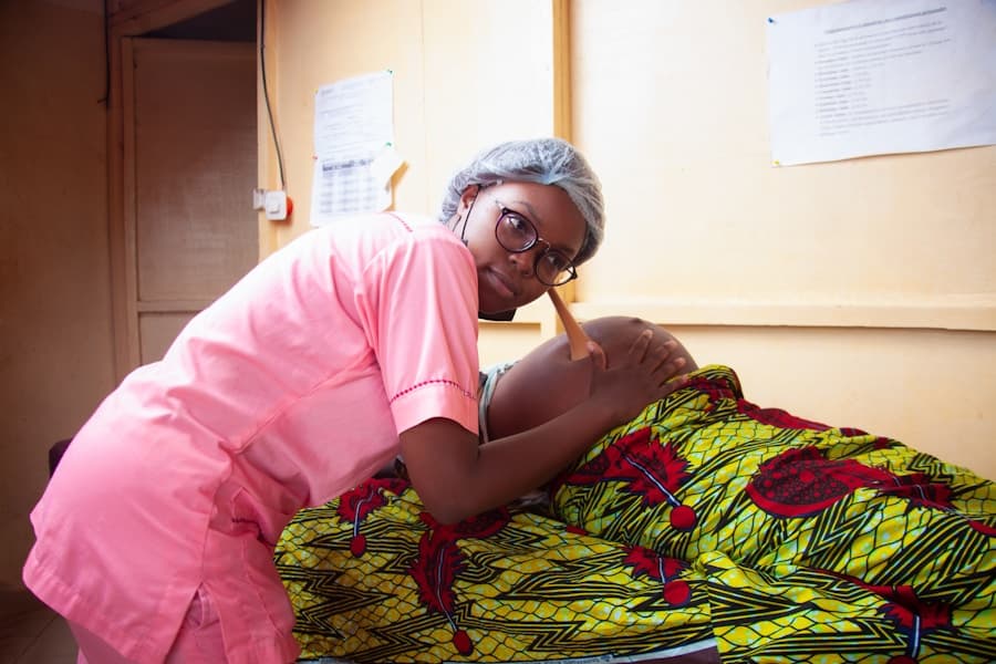 Nigerian nurse providing hands-on community care at a rural health facility
